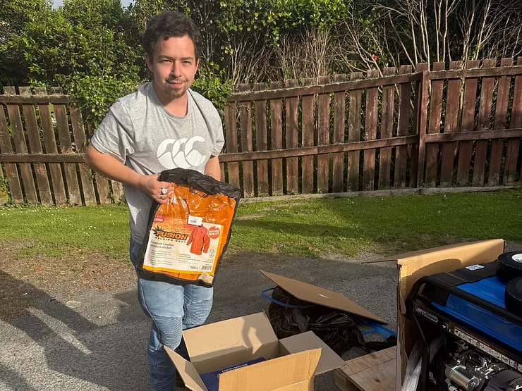 Harley outdoors with boxes of new welding gear