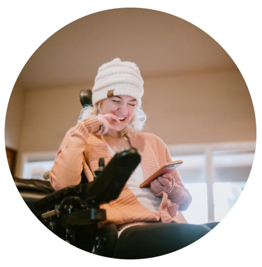 Woman in a wheelchair using an iPad